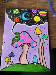 an acrylic painting of mushrooms and planets on a purple background with colored pencils