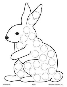 a rabbit sitting on the ground with dots in it's body and its legs spread out