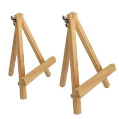 two wooden easels sitting next to each other