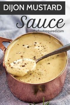 a pot filled with sauce sitting on top of a blue cloth next to a spoon