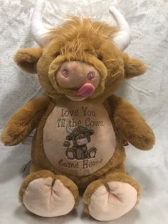 a stuffed animal with an i love you in the cows shirt