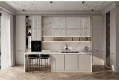 a kitchen with marble counter tops and white cabinets