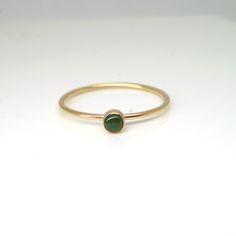 simple bezel ring with natural olive green jade -14k yellow gold -3mm natural gemstones -custom birthstones are available Simple Ring With Stone, Everyday Green Stackable Rings With Bezel Setting, Green Minimalist Stackable Rings With Bezel Setting, Minimalist Green Stackable Rings With Bezel Setting, Minimalist 14k Gold Emerald Ring With Bezel Setting, Minimalist Emerald Ring With Bezel Setting, Green Minimalist Birthstone Ring With Round Band, Minimalist Green Birthstone Ring, Dainty Green Emerald Ring With Bezel Setting