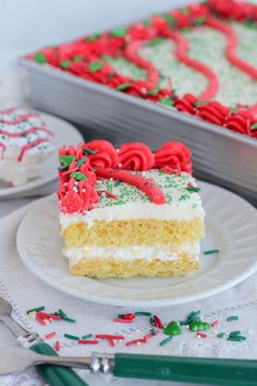 a piece of cake on a plate with red and green sprinkles next to it