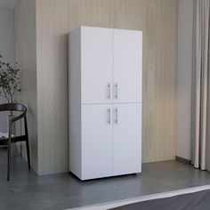 a white cabinet next to a black chair