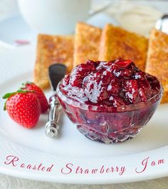 there is a bowl of fruit and toast on the plate