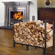 a pile of firewood sitting in front of a fireplace