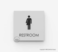 a restroom sign with the word restroom on it and a person's silhouette in black