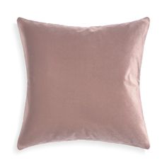 a pink pillow on a white background