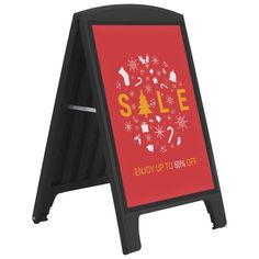 a sign advertising sale with snowflakes and christmas decorations on red, black frame