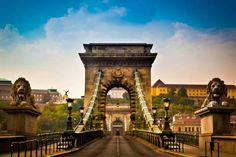 an old bridge with lions on the sides