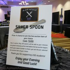 a sign advertising silver spoons at an event