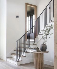 a staircase with the words click to shop above it and an image of a vase on top