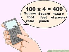 a hand holding a calculator with the words square and foot feet on it