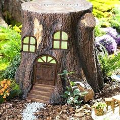 a tree stump with a house built into it