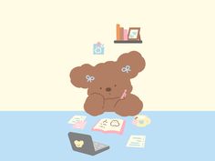 a brown teddy bear sitting on top of a blue table next to a laptop computer