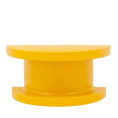 a yellow plastic object on a white background