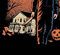 a man holding a skateboard in front of a house with pumpkins on the ground