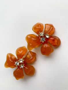 Large Floral Gripoix style earrings by Couture collection of an Iconic American Jewelry Designer Kenneth Jay Lane - signed also retain its original holder. They are in great vintage condition - flowers measure 1.5 inches high - beautiful bright orange color. Please look at all the pictures, video and dimensions carefully as I don't accept returns. Generally I ship the next day - please reach out if you have any questions - Thank you for coming to my store Cheap Traditional Orange Jewelry, Elegant Orange Flower Earrings, Vintage Flower Earrings, Orange Blossom Costume, Blossom Costumes, Orange Jewelry, Collection Couture, Orange Earrings, Orange Flower