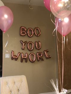 balloons and streamers in the shape of letters that say boo you whirl