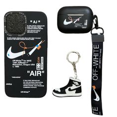 an air jordan shoe keychain with a pair of scissors next to it and a case