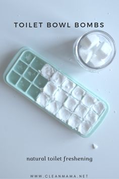 there is a small ice cube on top of a keyboard next to a glass of water