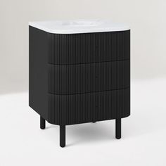 a black and white cabinet with two drawers on one side and a sink on the other