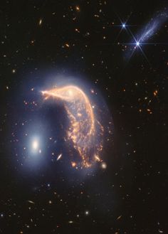 an image of a spiral shaped object in the middle of some space with stars around it