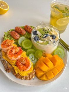 a white plate topped with fruit and veggies