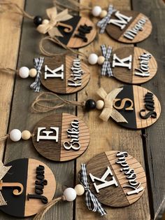 wooden name tags with black and white accents on a wood table, decorated with string