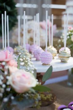 there are some cake pops on the table