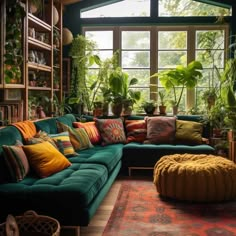 a living room filled with lots of green plants