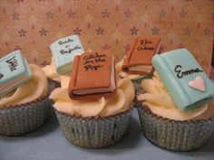 cupcakes decorated with books and writing on them