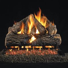 a fire is burning in the fireplace with logs