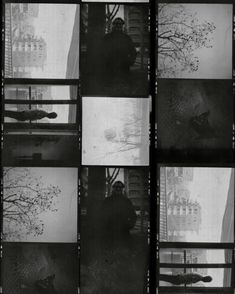 black and white photograph of man sitting on window sill