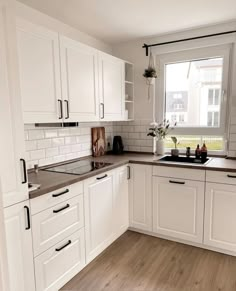 the kitchen is clean and ready for us to use it's new cabinets, counter tops, and flooring