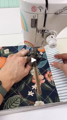 someone is using a sewing machine to sew something