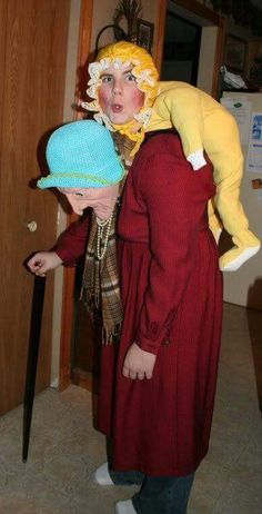 two people dressed up in costumes with hats on their heads