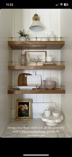 the shelves in this kitchen are filled with dishes and other things to put on them