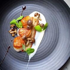 a blue plate topped with food on top of a table