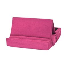 a fuchsia pink couch with two pillows on it's back and the seat folded up