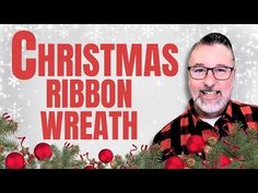 a man standing in front of a christmas card with the words, christmas ribbon wreath