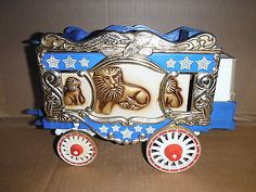 a small toy horse drawn carriage with wheels