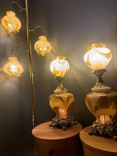 two lamps sitting on top of a wooden table