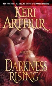 the cover of darkness rising by keri arthrur, featuring an angel with wings