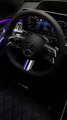 the steering wheel and dashboard of a mercedes c - class coupe