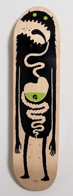 a skateboard with an image of a creature on it