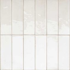 a white tiled wall with no one in it