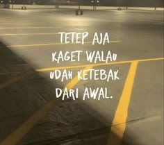 an empty parking lot with the words tetep aa kagett walan udah ketebak dari awal