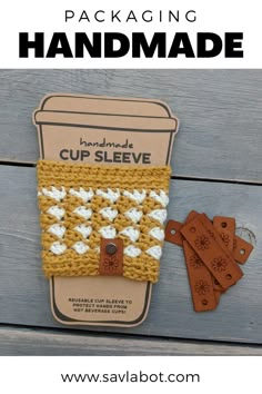 the handmade cup sleeve is next to some tags